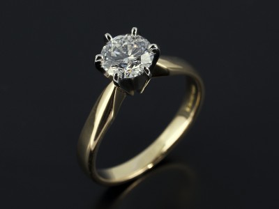 Round Brilliant 0.90ct D Colour SI1 Clarity Triple Excellent Grade in a 6 Claw Platinum Setting with 18kt Yellow Gold Band.
