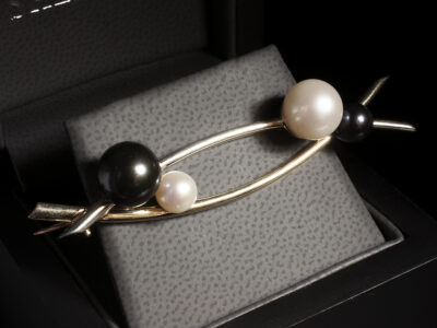 9kt White and Yellow Gold Crossover Brooch Design with White and Dark Pearl Accents