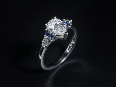 Ladies Diamond and Sapphire Engagement Ring, Platinum Claw Set Design, Pear Cut Lab Grown Diamond 1.01ct, Marquise Cut Lab Grown Diamond Side Stones with Round Cut Blue Sapphires (4)