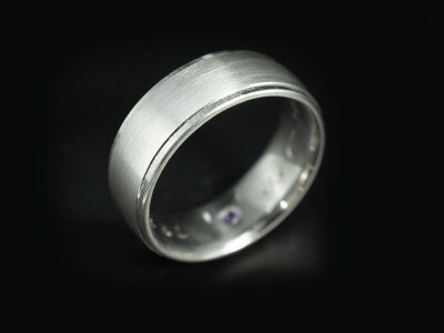 Gents Brushed Wedding Ring, Platinum 7mm Court Shape Design, Brushed Centre with Stepped Edge, Round Amethyst 0.09ct Secret Set on Inner Band