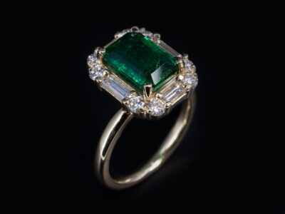 Ladies Emerald and Diamond Halo Dress Ring, 18kt Yellow Gold Claw Set Design, Octagonal Emerald 2.42ct, Round Brilliant Cut Diamonds 0.30ct (8), Baguette Cut Diamonds 0.53ct (4), F Colour, VS Clarity