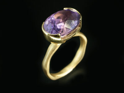 Ladies Solitaire Amethyst Dress Ring, 18kt Yellow Gold Part Rub over Design, Oval Cut Amethyst 3.90ct, Wave Band Detail