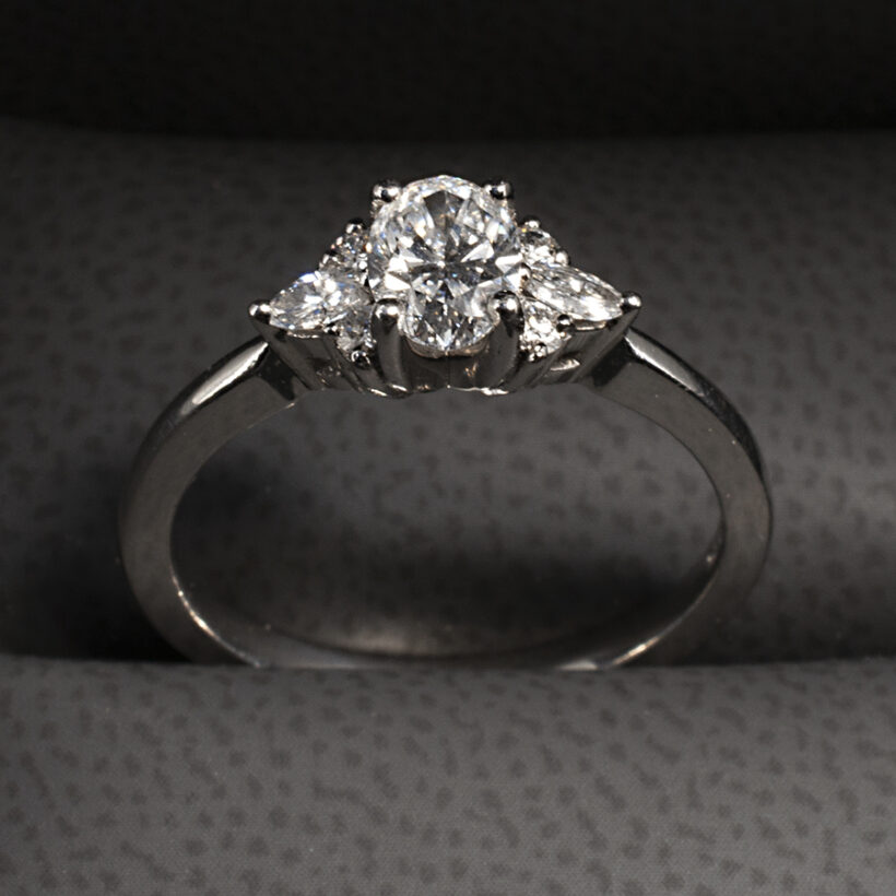 Platinum Claw Set Lab Grown Diamond Engagement Ring, Oval Cut 0.56ct, Marquise Cut 0.20ct Total (2), Round Brilliant Cut Diamonds 0.08ct Total (4)