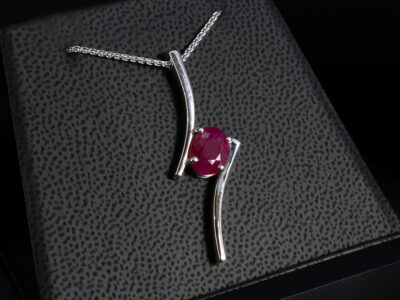 9kt White Gold Solitaire Ruby Pendant, 4 Claw Set Contemporary Design, Oval Cut Ruby 2.43ct