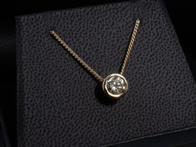 9kt Yellow Gold Diamond Solitaire Pendant, Floating Rub over Design, Round Brilliant Cut Diamond 1.23ct