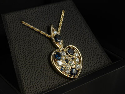 9kt Yellow Gold Heart Design Diamond and Sapphire Pendant, Claw and Rub over Set Twist Design, Round Brilliant Cut Sapphires 0.46ct (2), Oval Cut Sapphires 0.42ct (2), Round Brilliant Cut Lab Grown Diamonds 2.31ct (15)