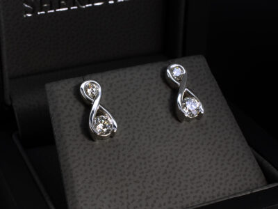 Platinum Twist Diamond Studded Earrings, Part Rub over Set Design, Round Brilliant Cut Lab Grown Diamonds 0.60ct Total (2), 0.20ct Total (2)