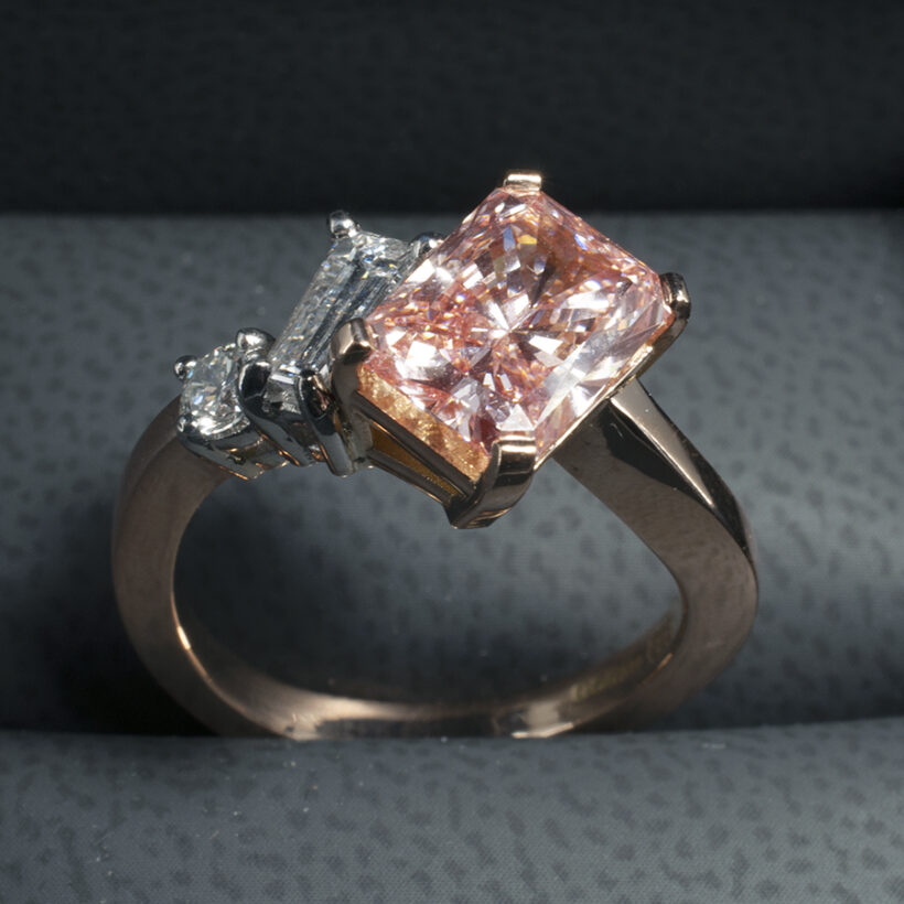 Fancy Pink Diamond Engagement Ring set in 18kt Rose Gold with White Diamond Side Stones