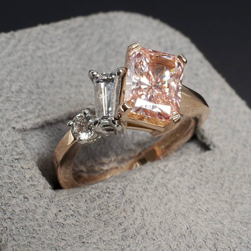 Fancy Pink Diamond Engagement Ring set in 18kt Rose Gold with White Diamond Side Stones