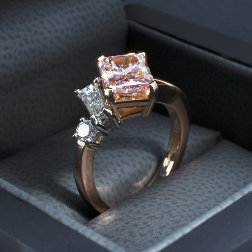 Fancy Pink Diamond Engagement Ring set in 18kt Rose Gold with White Diamond Side Stones