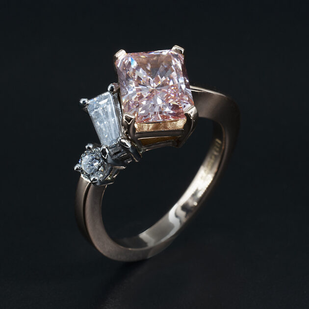 Fancy Pink Diamond Engagement Ring set in 18kt Rose Gold with White Diamond Side Stones